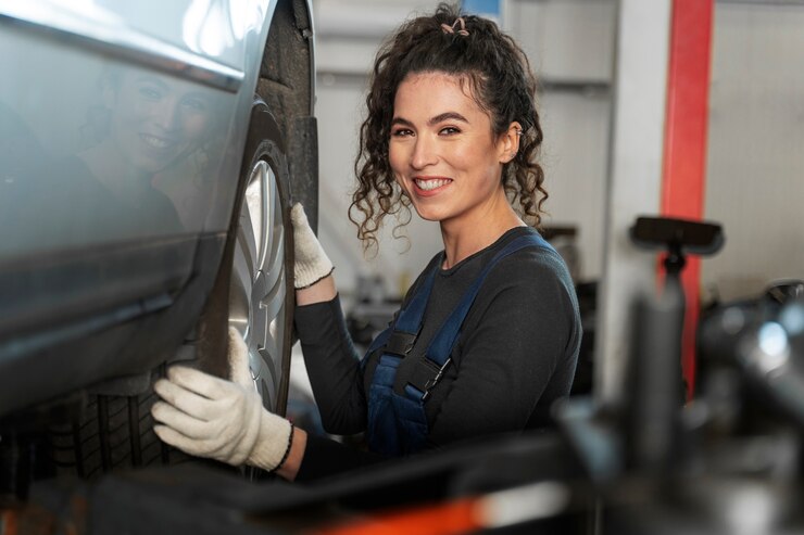 side-view-smiley-woman-changing-wheel_23-2150171279