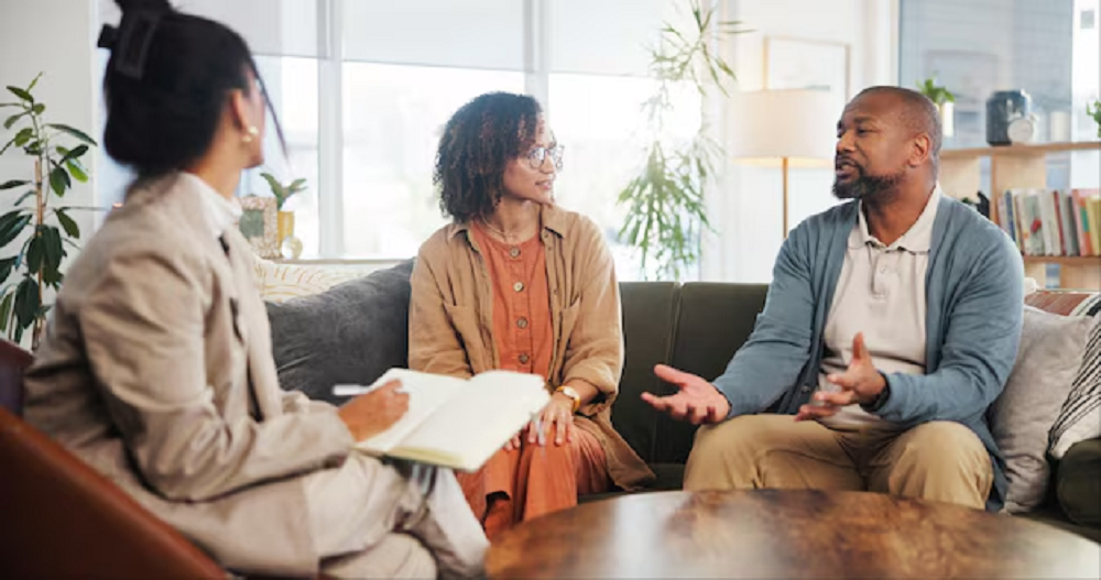 Couple therapy and discussion with notes in office