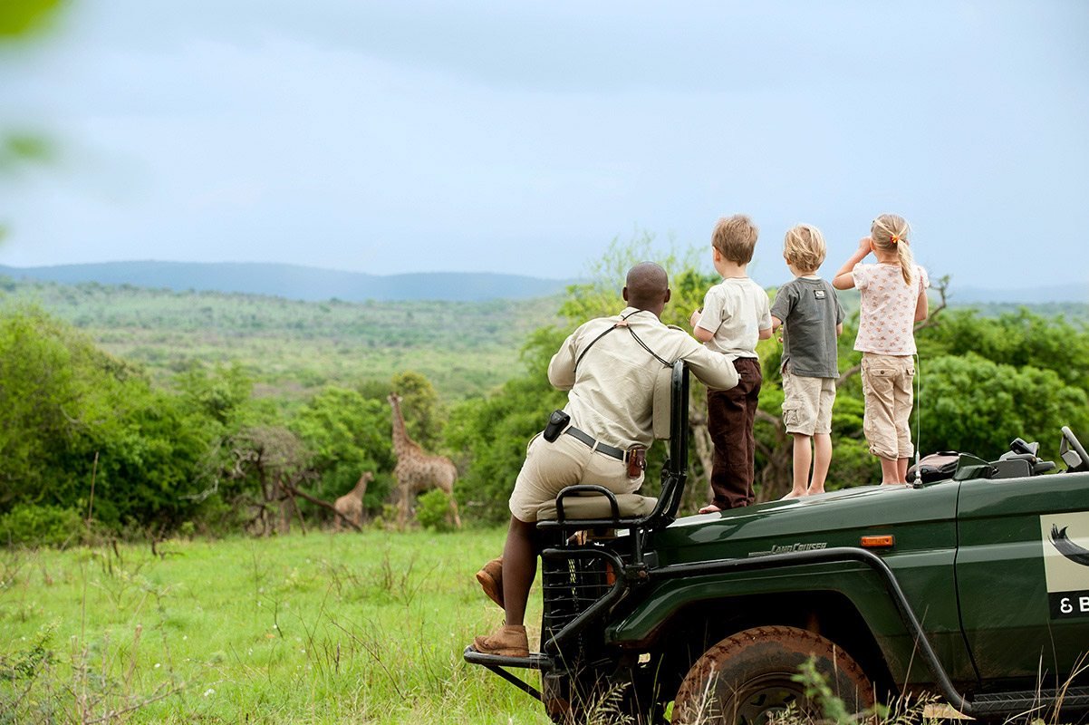 Family Safari Holiday in Africa with kids enjoying wildlife tour