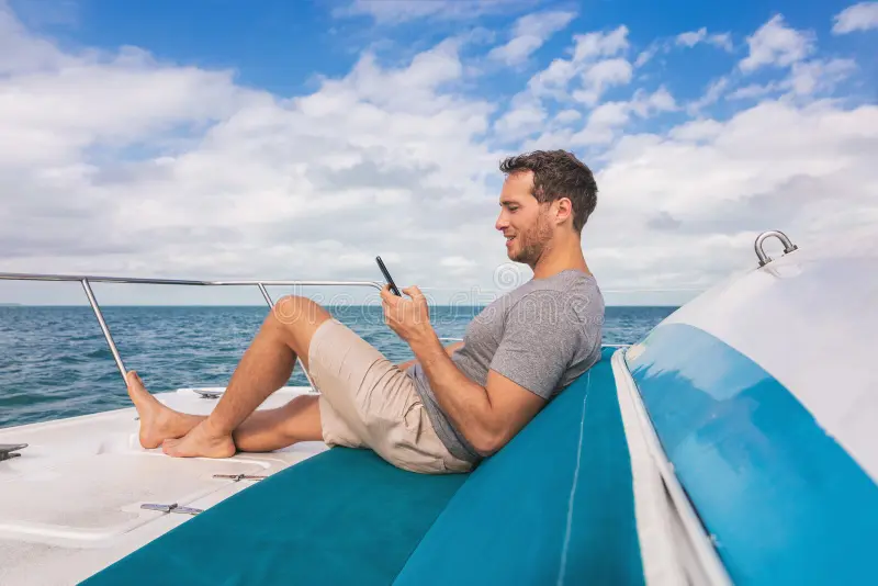 Relaxed traveler on a yacht enjoying a safe trip without seasickness