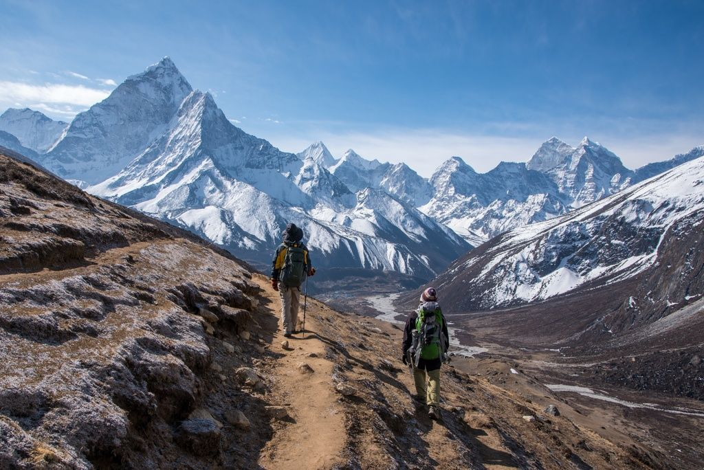Trekking package in Nepal with adventure travelers exploring the Himalayan trails.