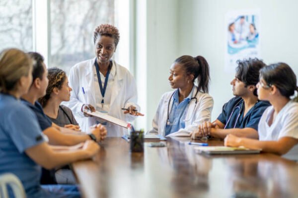 Surgeon holding scalpel and business leader in boardroom symbolizing leadership lessons