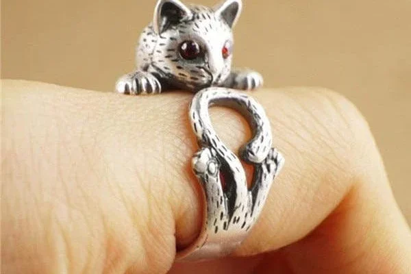Silver cat ring featuring gemstone cat eyes
