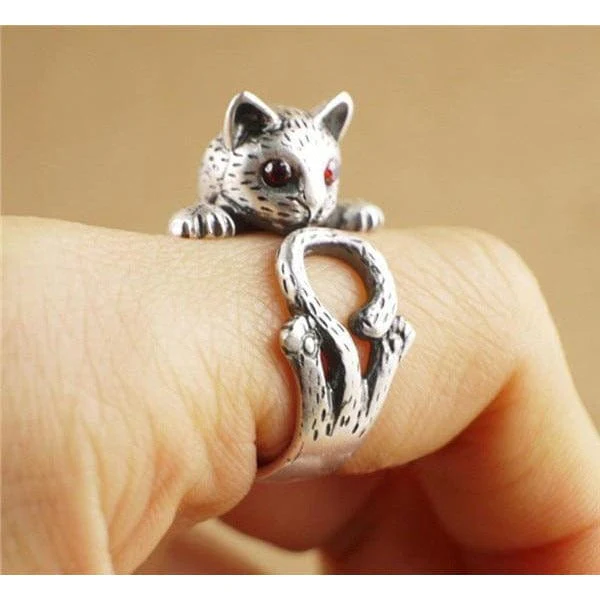 Silver cat ring featuring gemstone cat eyes