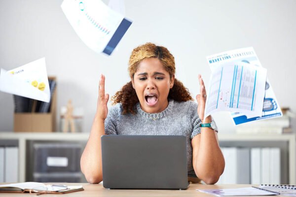 3 Common Mistakes Avoided By Hiring A Tax And Accounting Firm Professional accountant reviewing financial documents to avoid common tax mistakes.