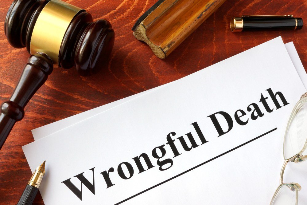 Lawyer comforting a grieving family during a wrongful death consultation.