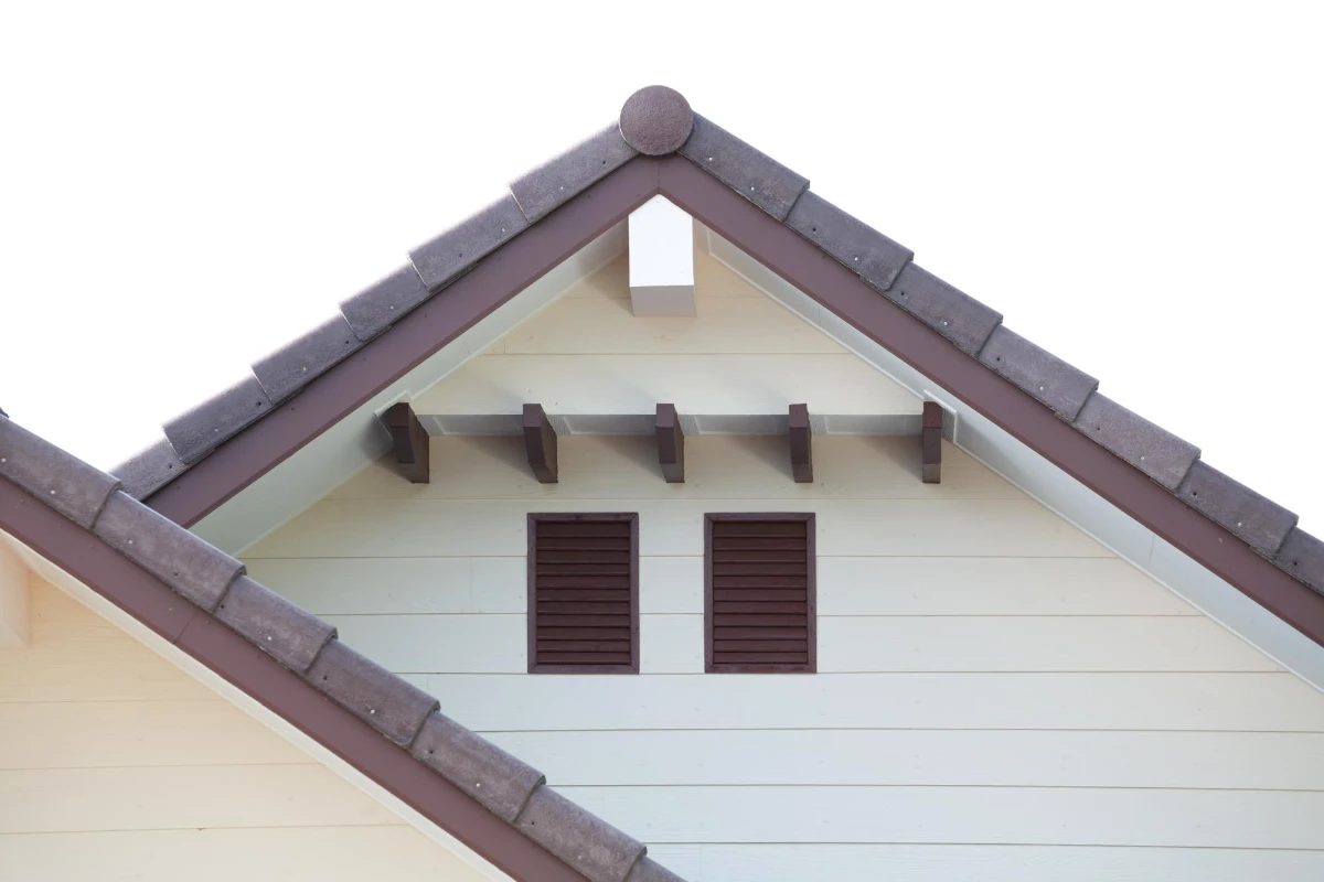 “Close-up of a Cape Cod style roof showing the rake edge and gable details”