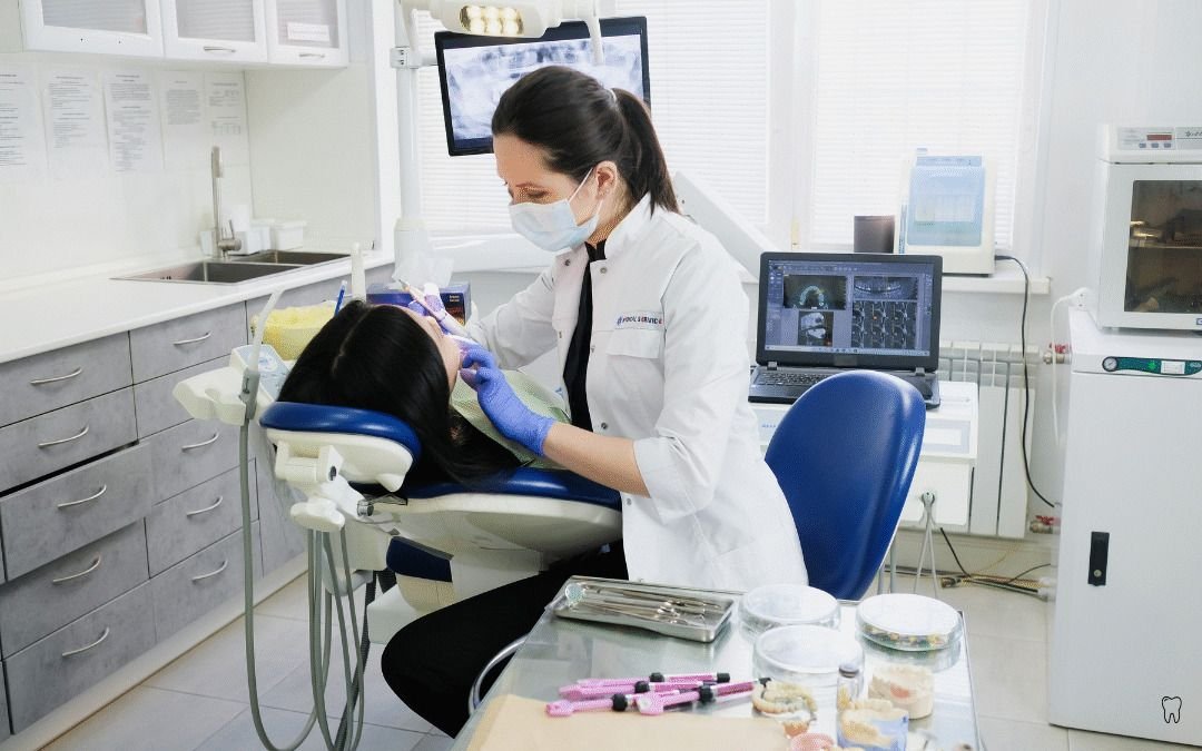 Family dentist providing cosmetic dental care to patients in a modern clinic