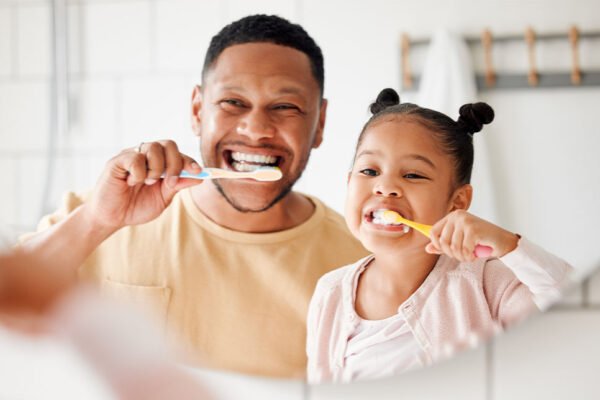 Family visiting a dentist together, showing dental care support for all life stages