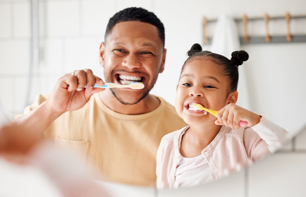 Family visiting a dentist together, showing dental care support for all life stages