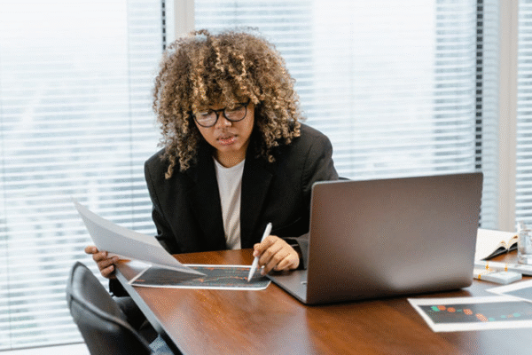 Journalists analyzing audience data for effective mass media communication