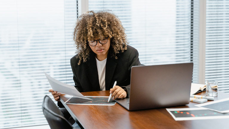 Journalists analyzing audience data for effective mass media communication