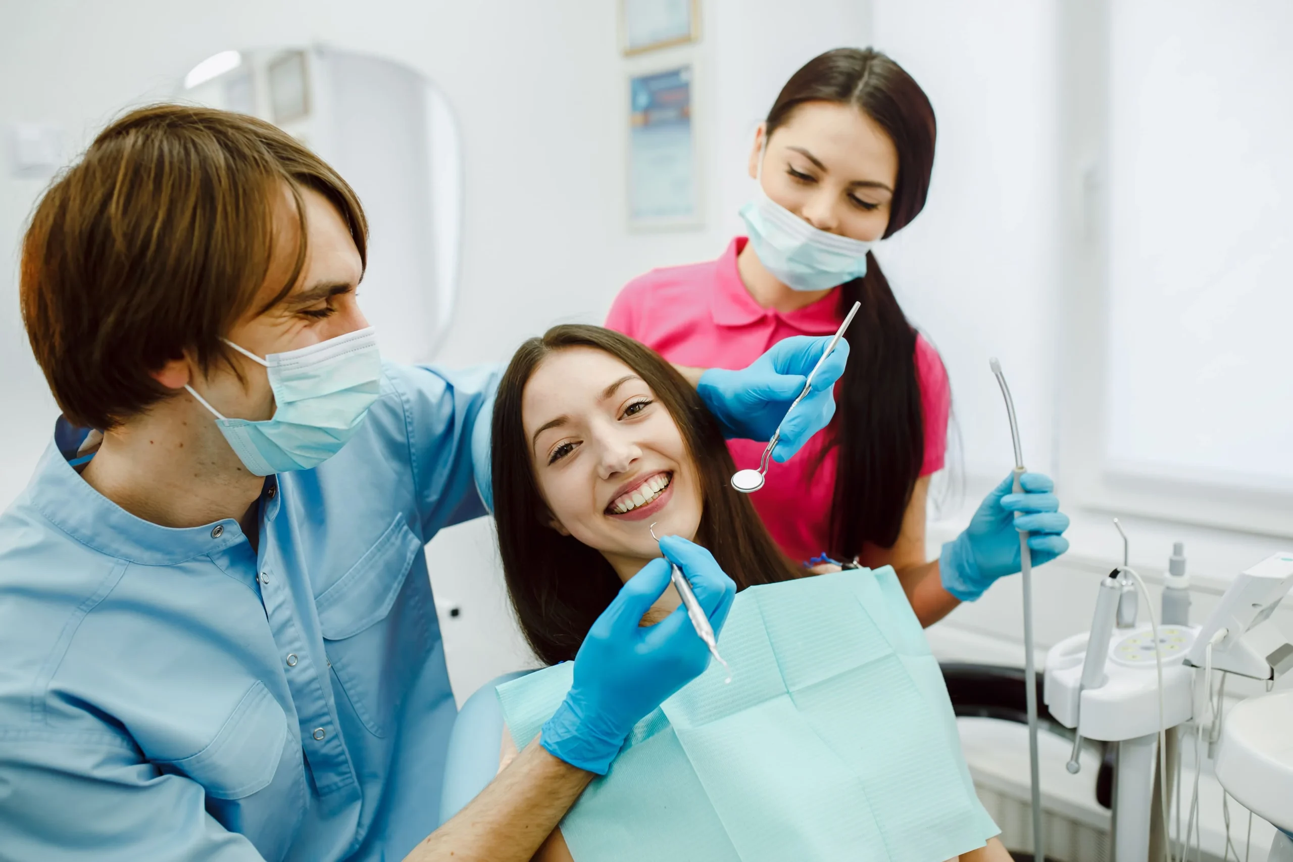 Dentist performing preventive dental care to promote oral and overall health