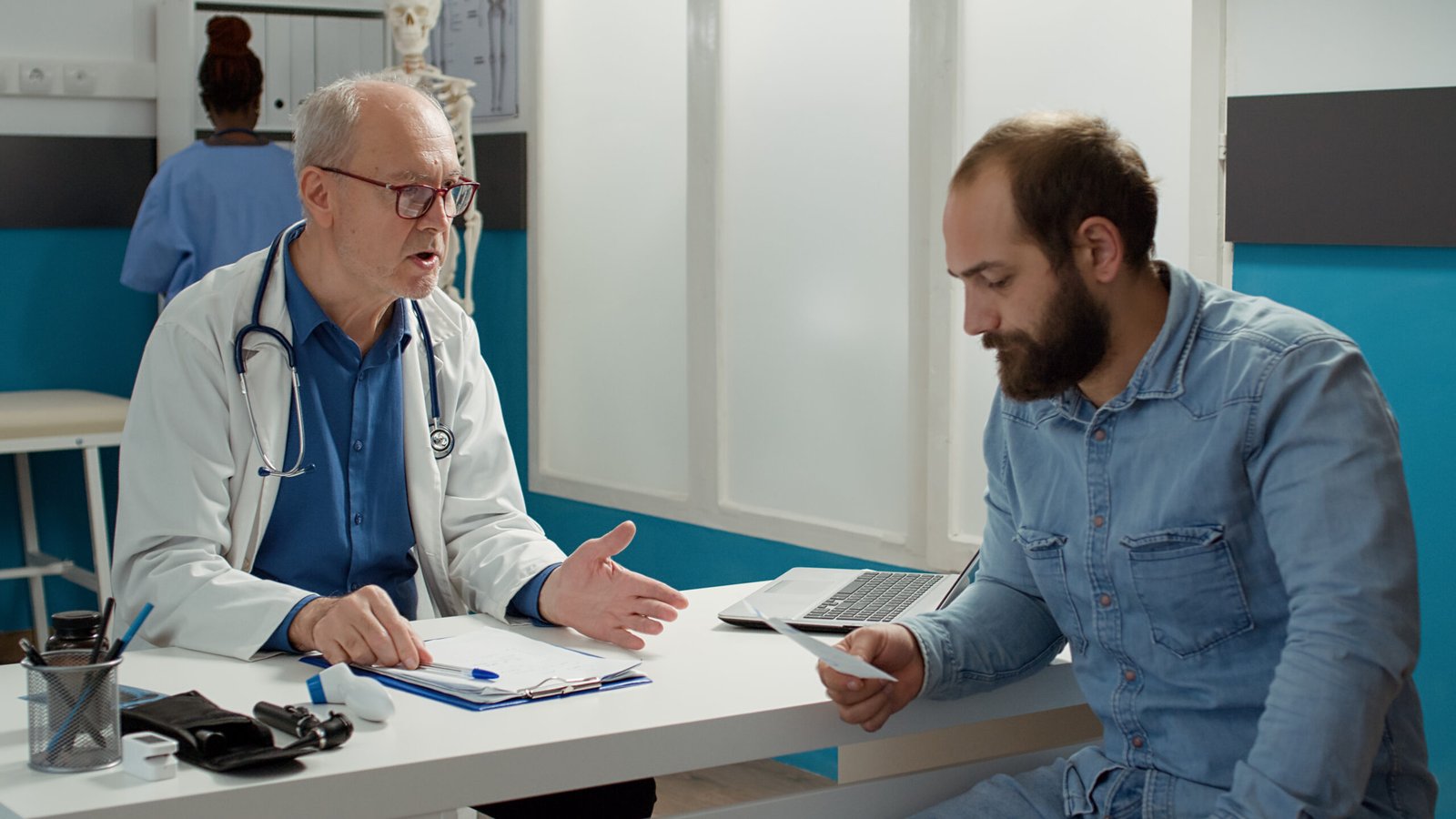Patient Discussing Colonoscopy Symptoms With Doctor
