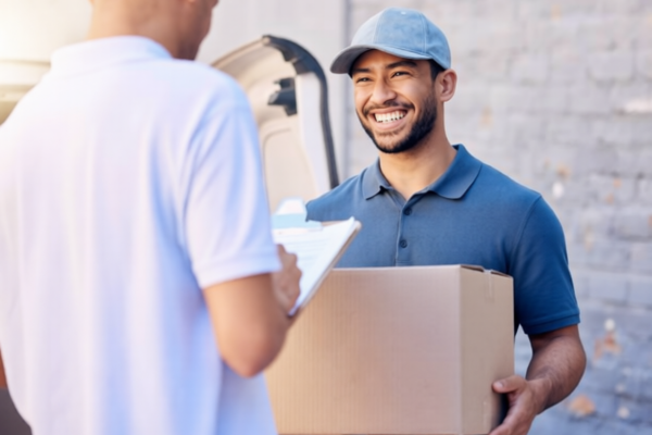 man Accepting Delivery Package From Courier