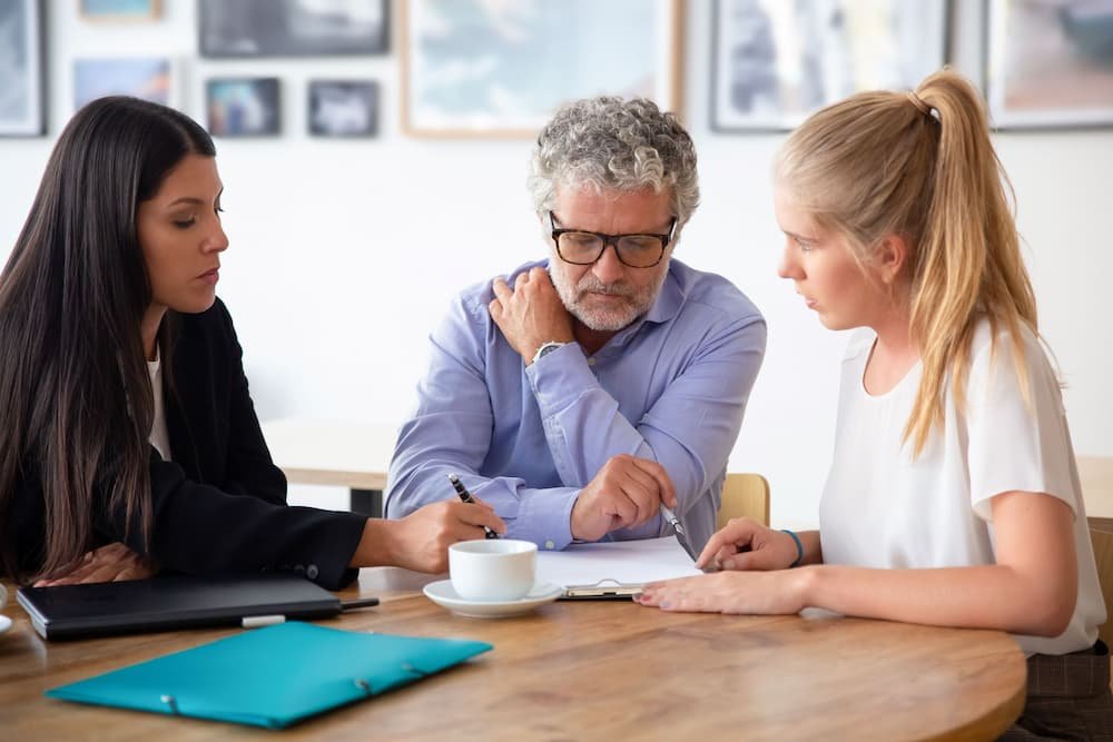 20333 Estate planning lawyer explains documents to senior father and adult daughter AdobeStock 377092353 resized