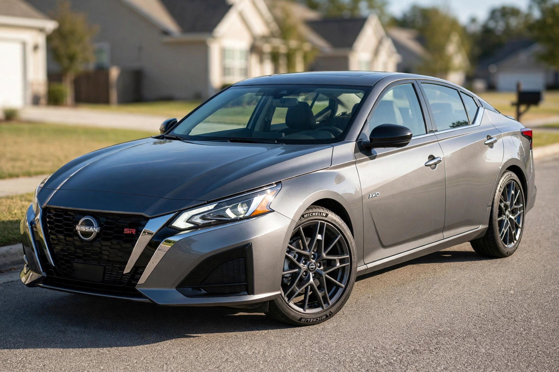 Nissan Altima Reliability hero shot of 2023 Altima SR AWD 6th generation in gunmetal gray on suburban street