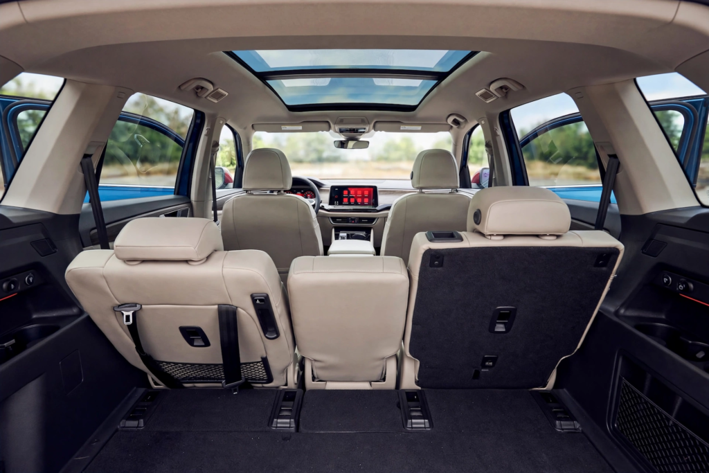 Volkswagen SUV Lineup Compared: Tiguan vs Atlas vs Taos vs Tiguan Allspace 3 Volkswagen SUV lineup interior showing Atlas third row seating with 7 passenger space and panoramic sunroof for large families