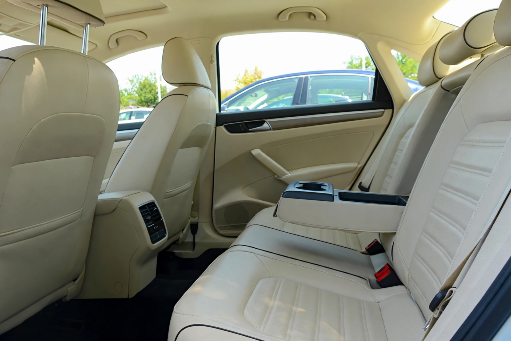  Spacious rear passenger legroom and comfort in Volkswagen Passat beige leather interior for family and long-distance driving