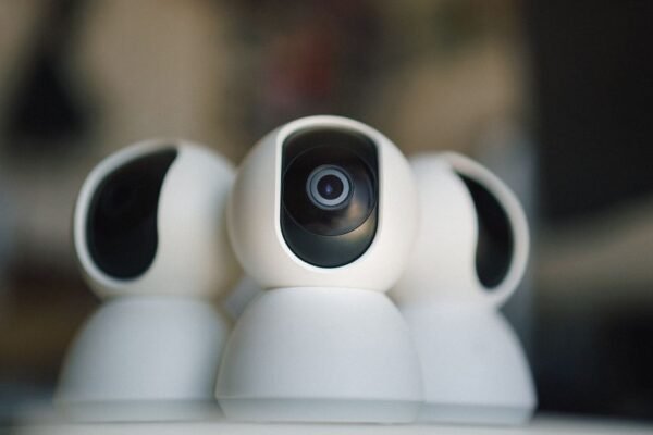 Professional IP security cameras from leading brands mounted on wall displaying network connectivity and integration features